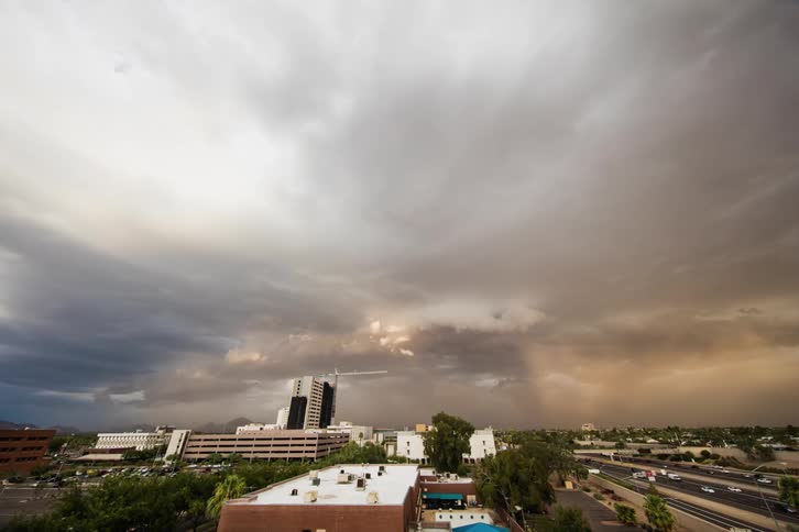Clouds build over a city