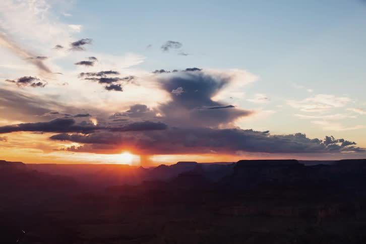 The clouds move over the horizon at sunset