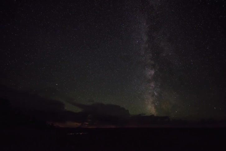 The clouds are flashing with lightning at night