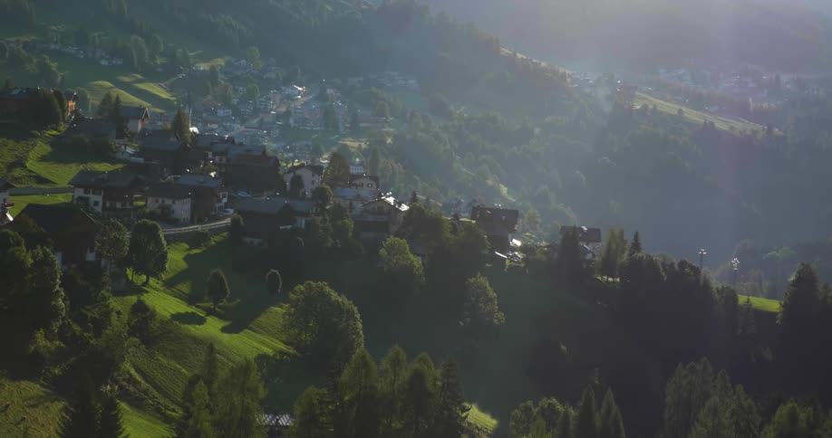 An overhead view of a city surrounded by trees