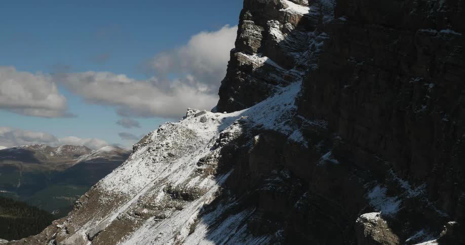 The very tall mountain is covered with ice and snow