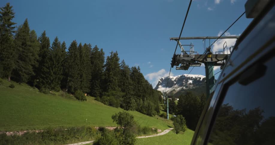View of a ski lift going over mountains
