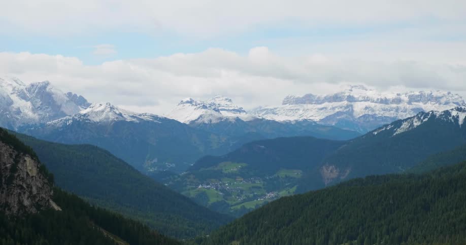 View of snowy mountains on a cloudy day