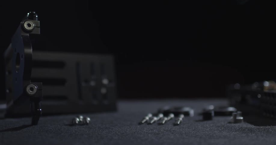 Parts and pieces of equipment are laid out in an orderly manner on a surface