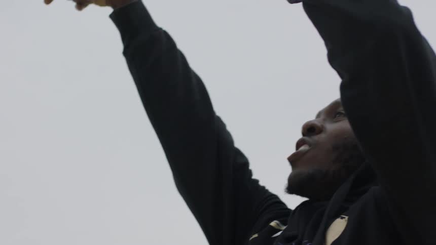 Man shoots a basketball outside