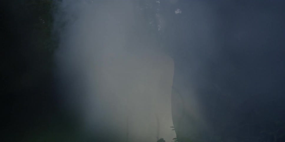 Light shining in a tunnel with smoke around it