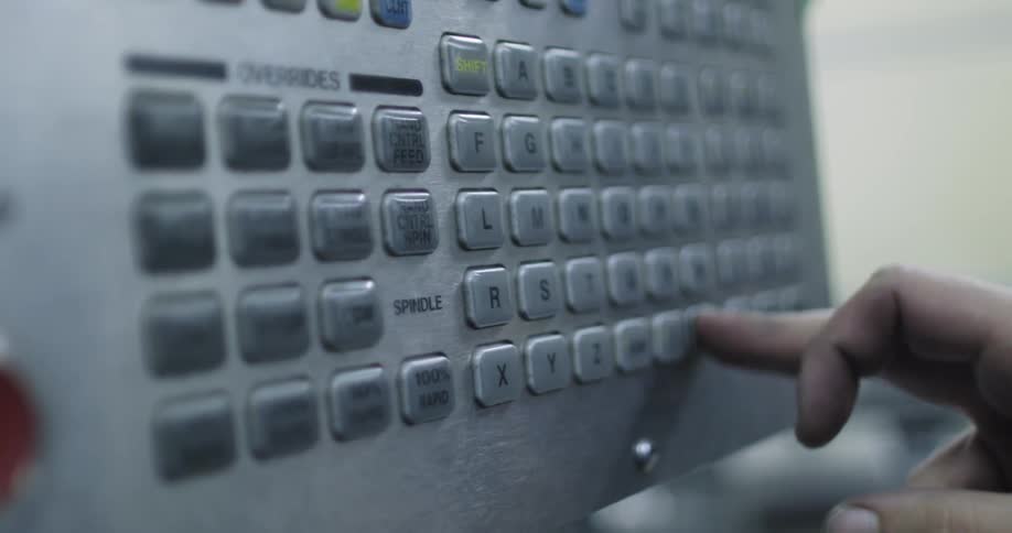 Person pushes buttons on a machine