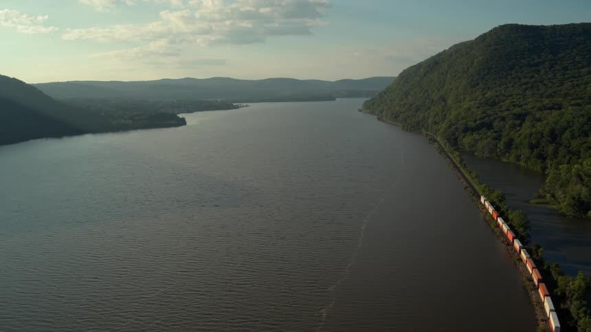 River flowing through hilly landscape