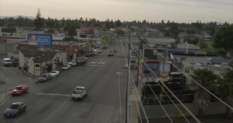 Traffic moves through the main street of a small town