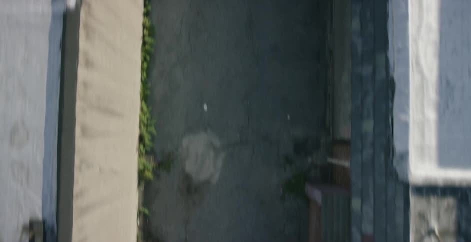 Aerial view of a sidewalk between buildings