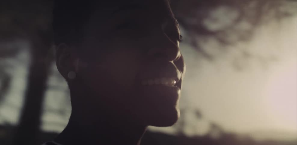 Woman looking out at the sun