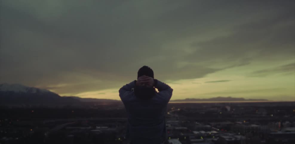 Person looking out at a city
