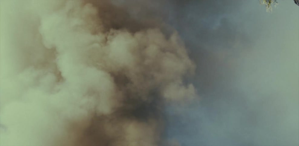 Clouds of smoke rise into the air