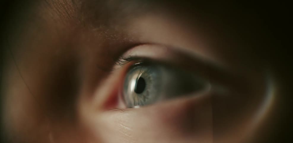 A blue eyeball looks around and blinks