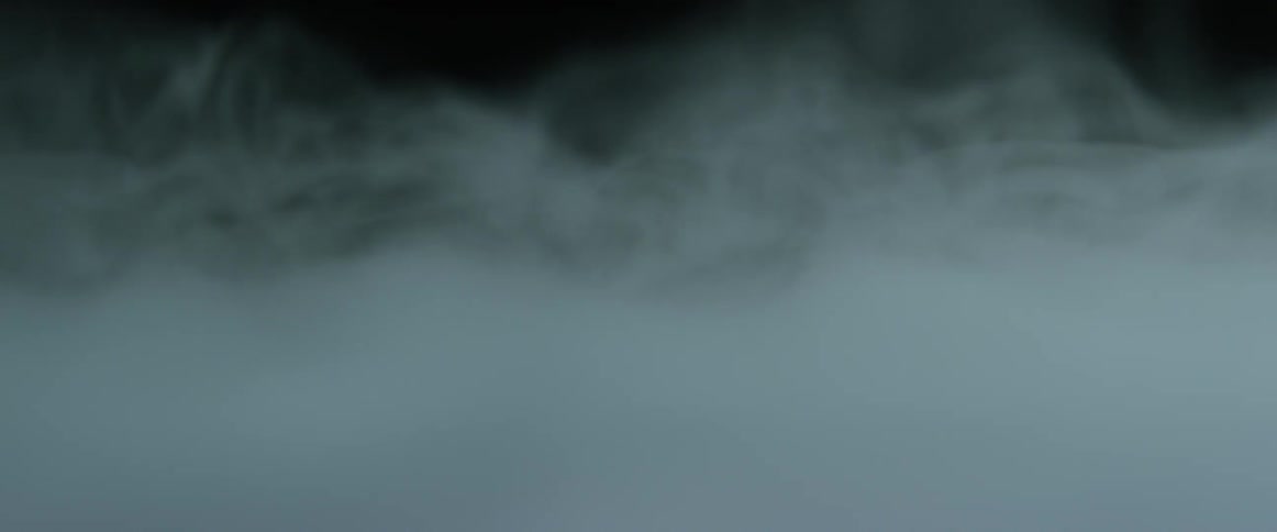 Abstract closeup of smoke swirling above an unknown surface