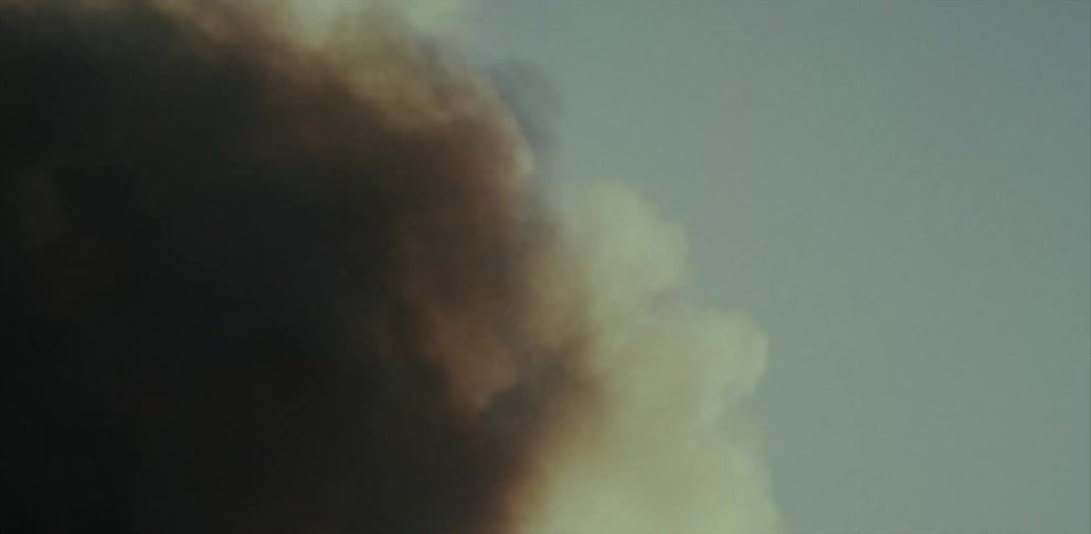 Smoke slowly swirls in the sky
