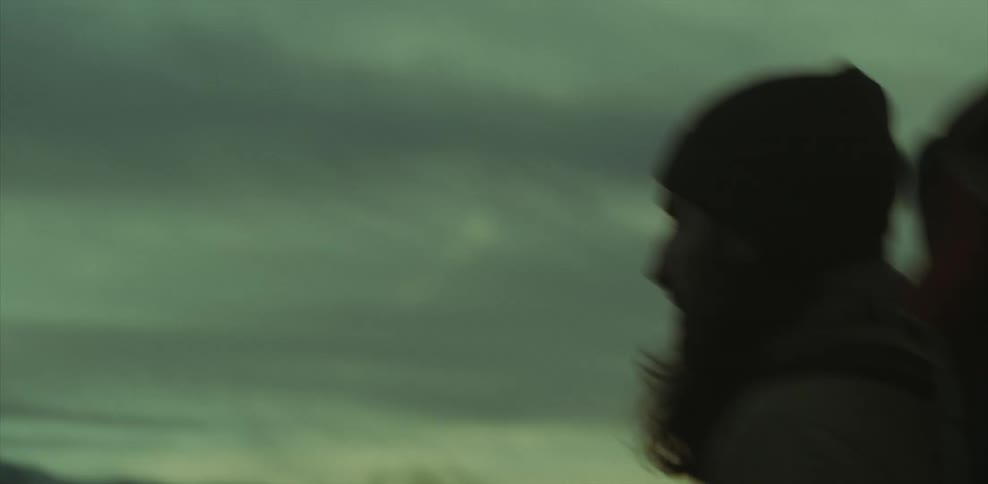 A man is hiking outside at dawn