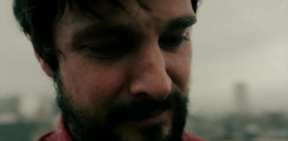 Close up of a man's face outside on a windy day