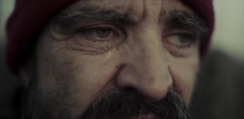 Close up of a man's face outside as he's crying