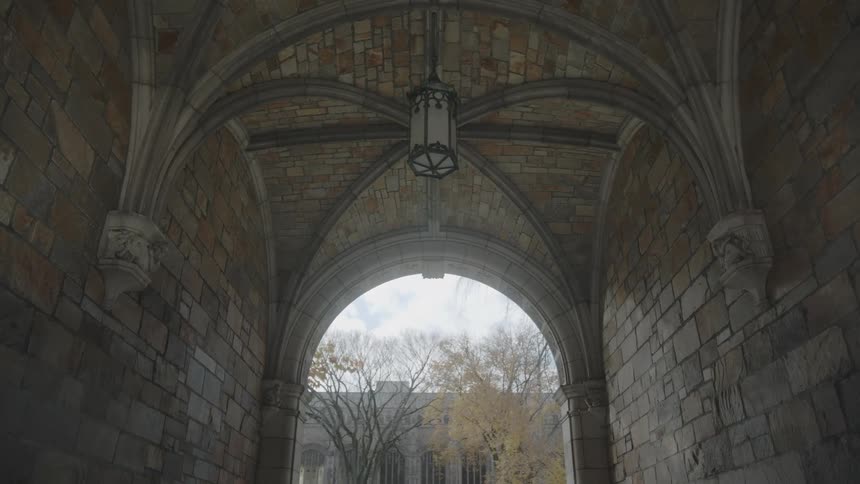 Lantern hanging from a stone archway