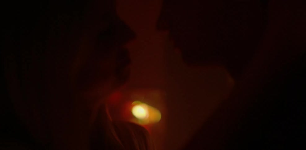 Man and woman making out in red light