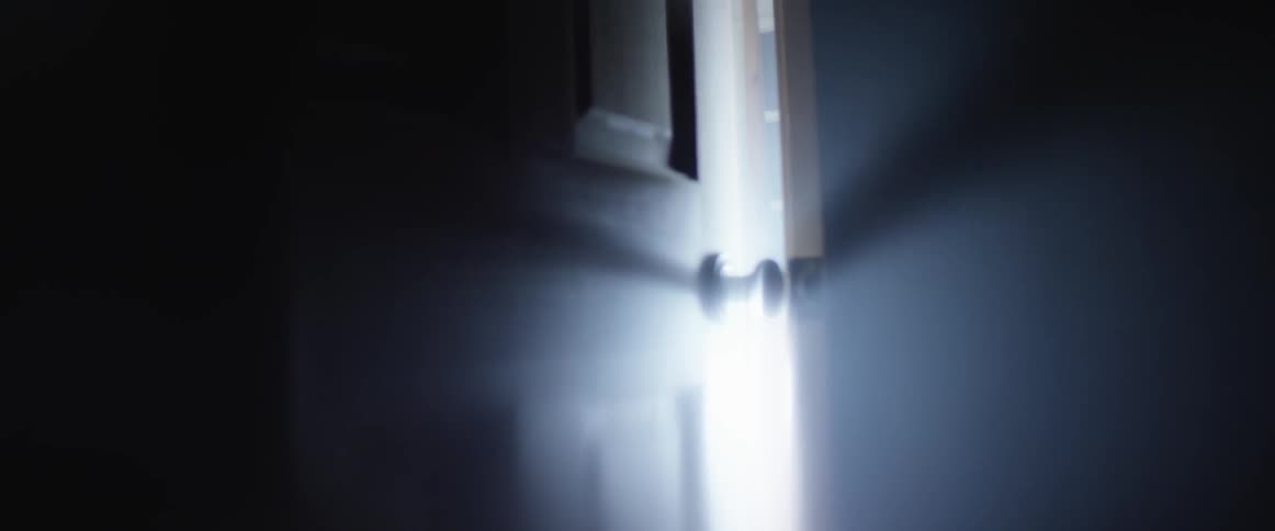 Close up of a door illuminated by bright light