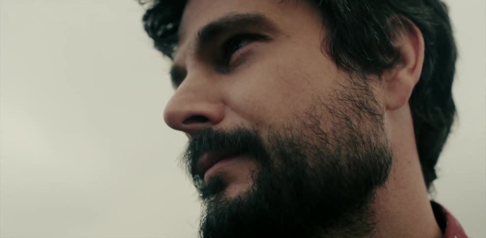 Close up of a man's face outside on a windy day