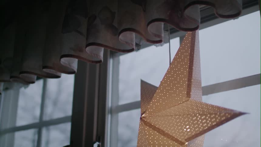 Close up of a star decoration hanging in a window
