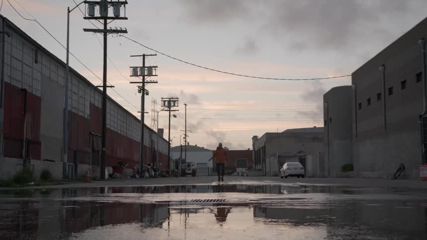 A person is jumping rope down the street
