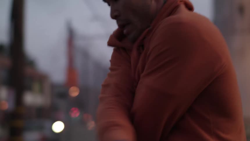 A man jumps rope in the street