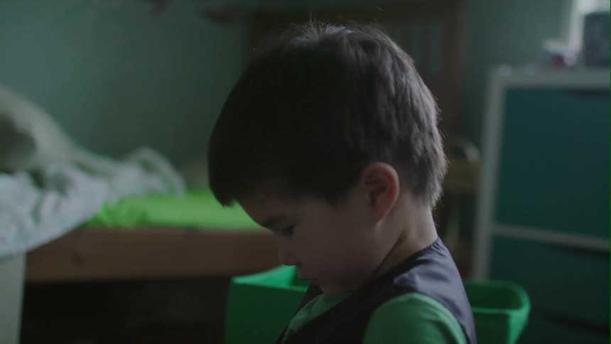A boy is playing in a room