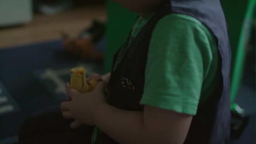 A boy is playing with a toy