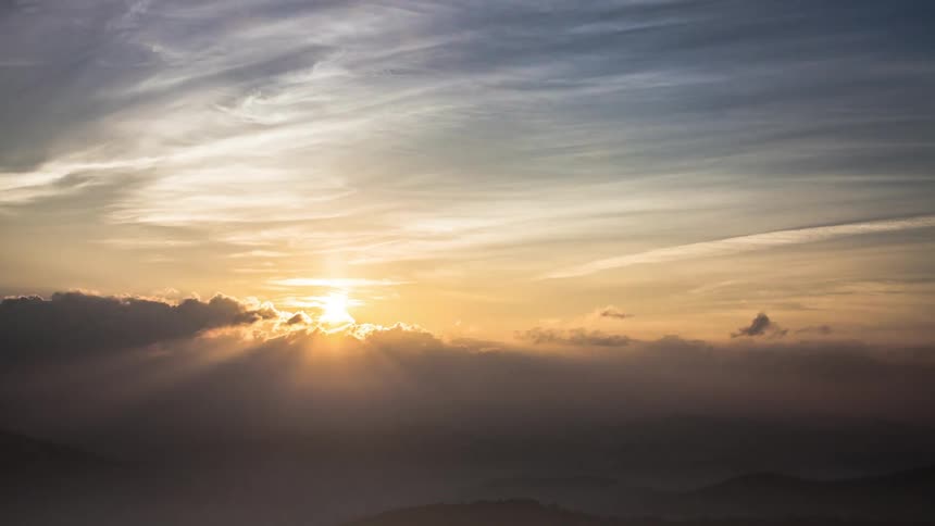Clouds floating in the sky at sunset
