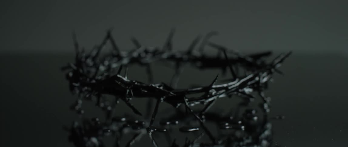 Crown of thorns sitting on a reflective surface