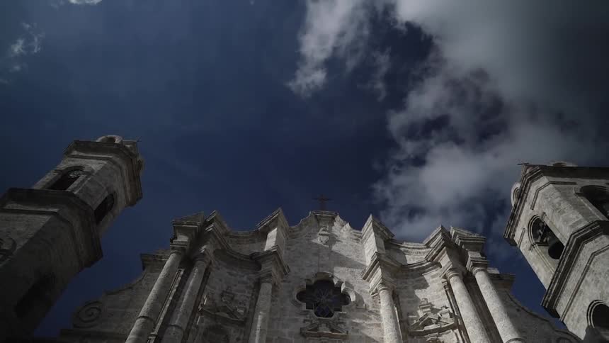 An old stone building towers into the sky