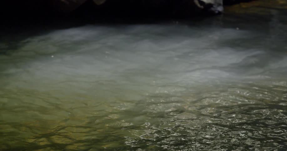 The water moves around with some clouds underneath