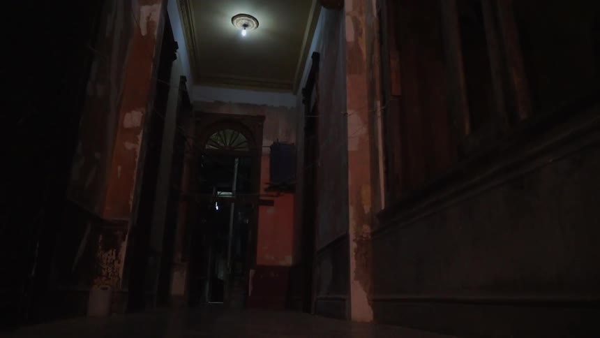 The hallway of this home is dark