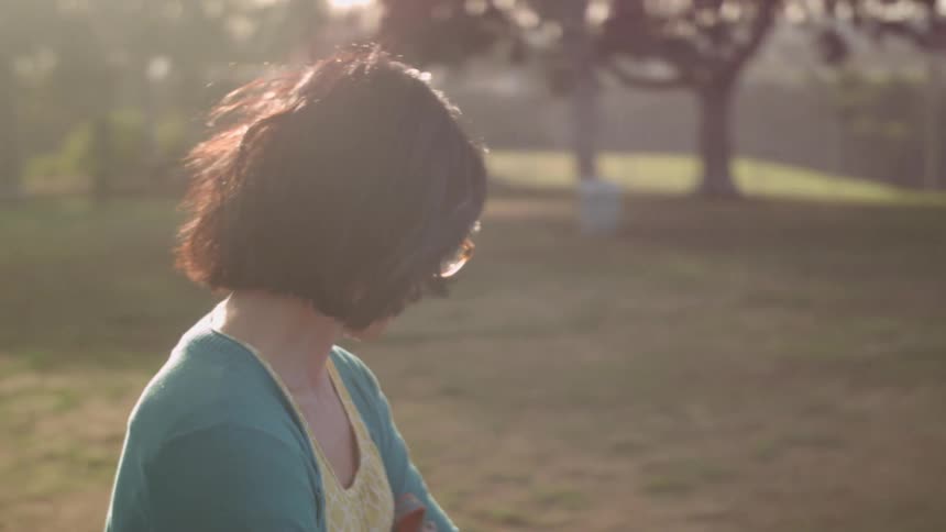 Woman smiling in a sunny field
