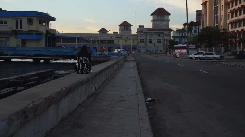 Vehicles pass by a road by the bridge