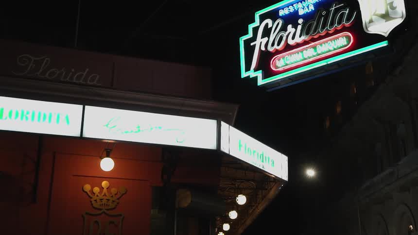 Building lit with neon signs at night