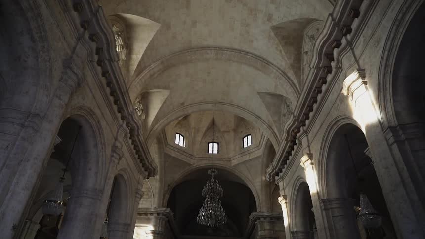 The domed ceiling of a cathedral is shown