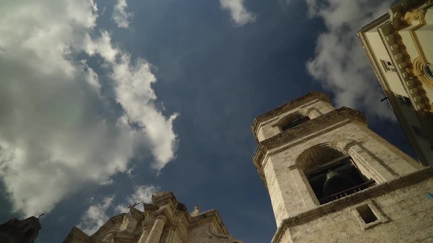 An old stone building towers into the sky
