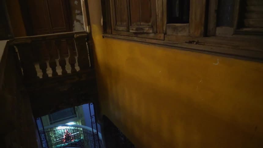 View of a hallway and staircase of an old building