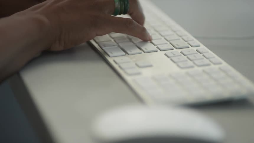 Woman typing on a keyboard