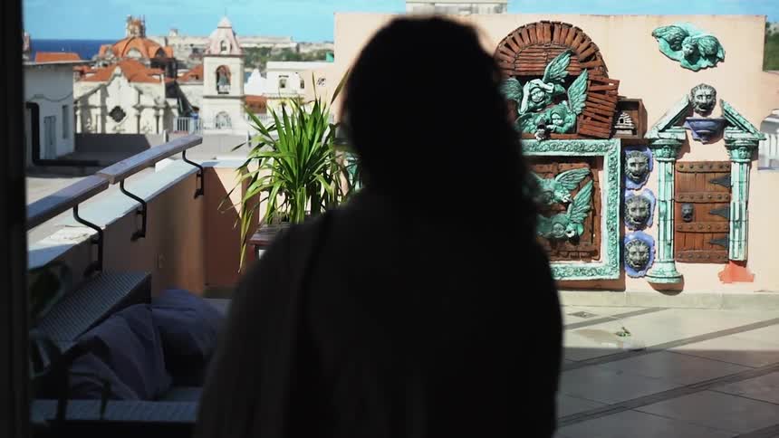 A woman is walking inside