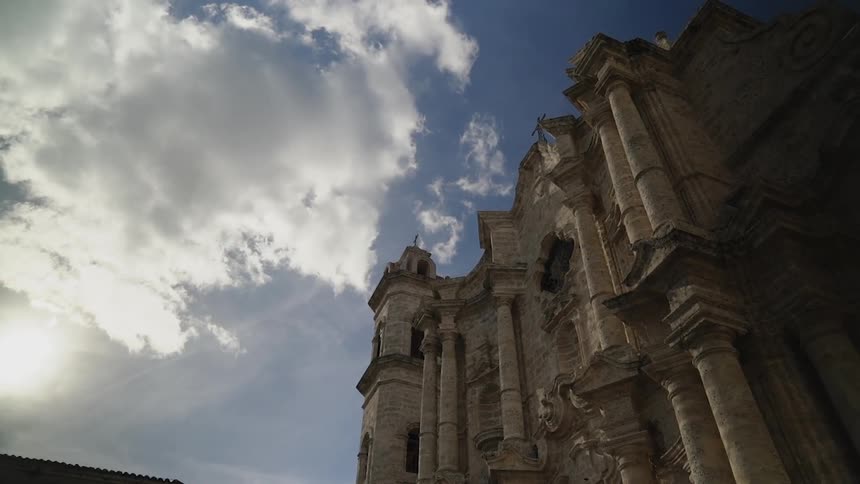 An old stone building towers into the sky
