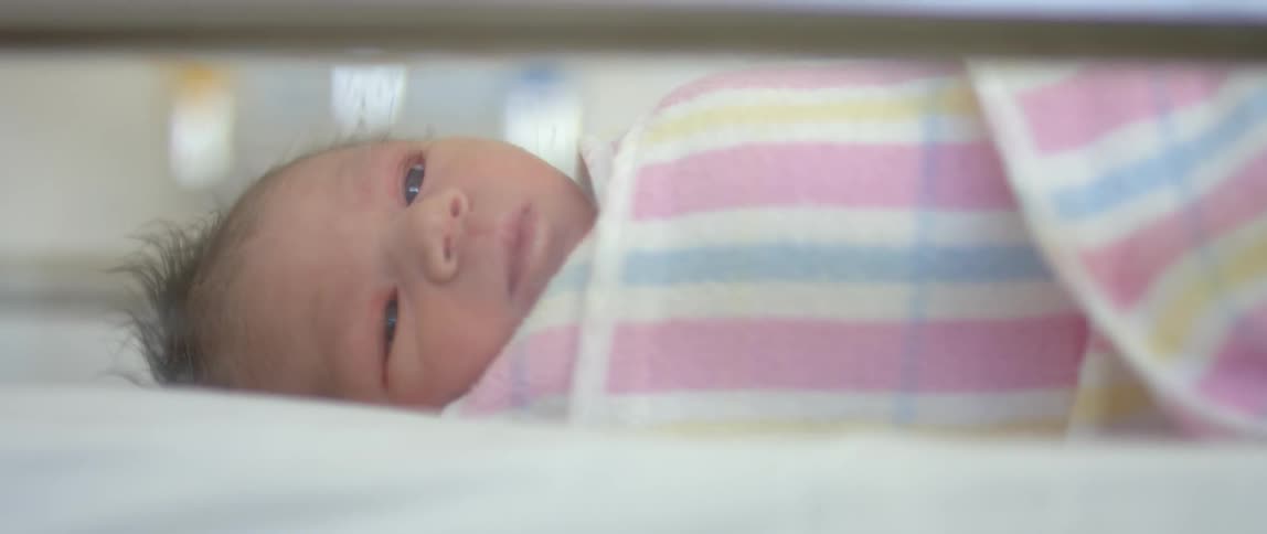Infant wrapped in a blanket