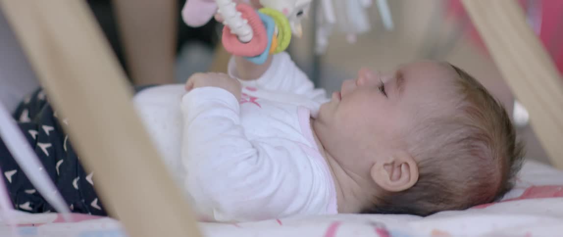 A baby cries in the crib
