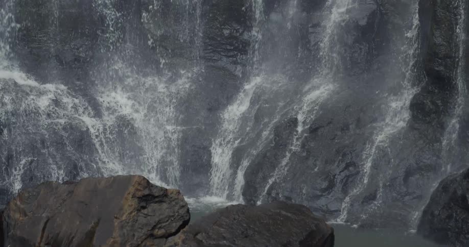 Water cascades over a cliffside