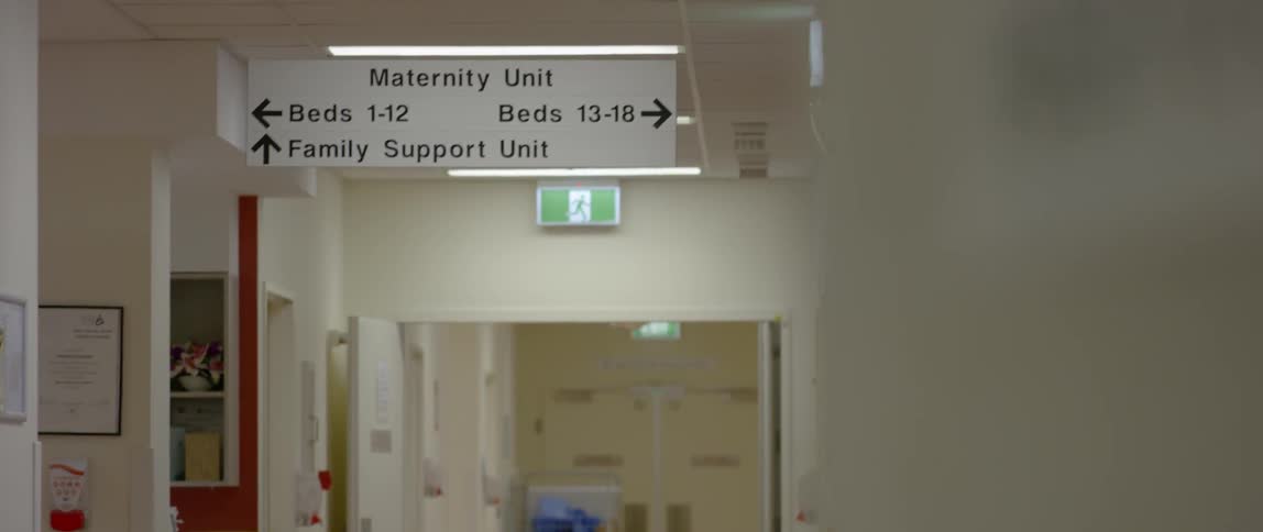A sign gives direction in a hospital
